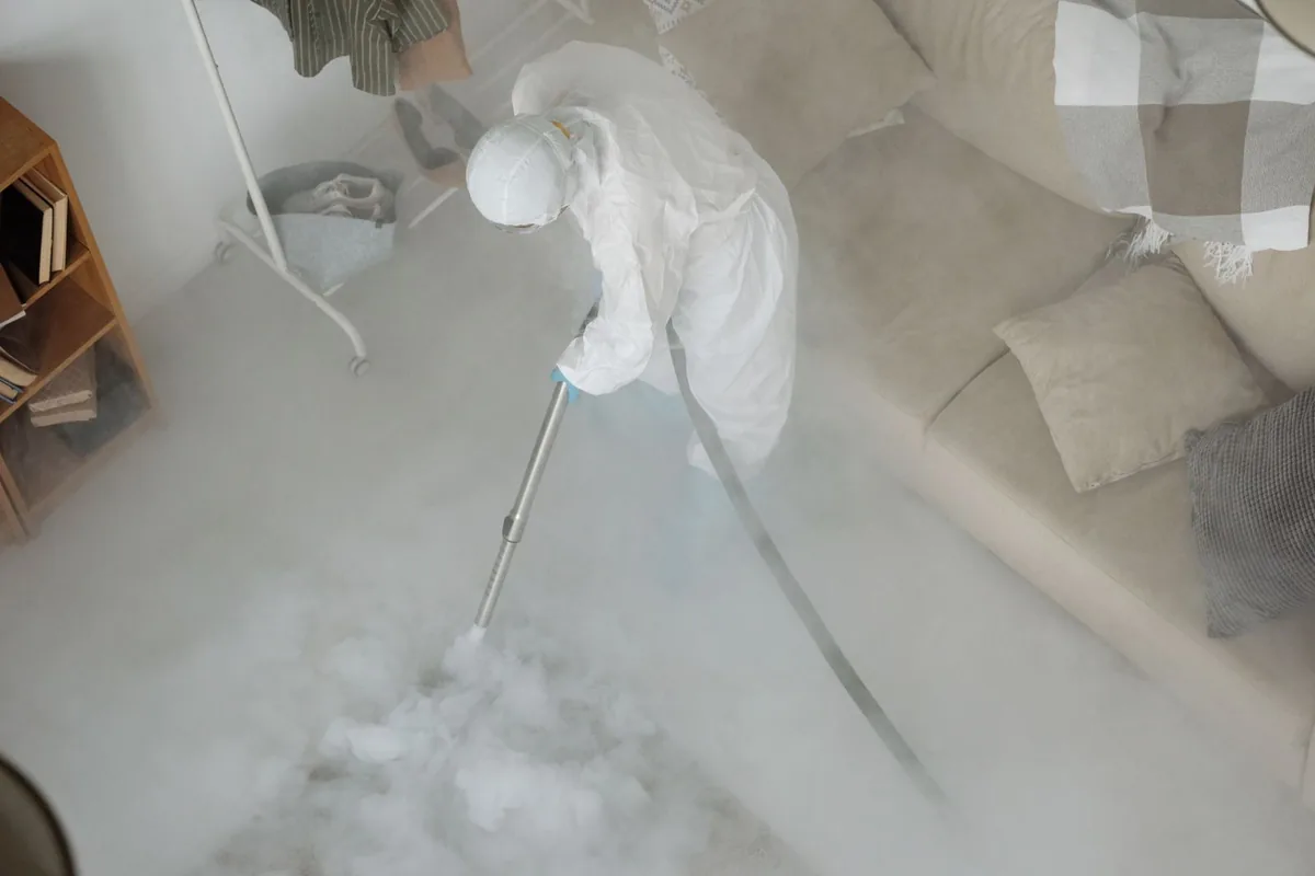 Biohazard cleanup technician in protective equipment, Echo Heights, Fort Worth, TX